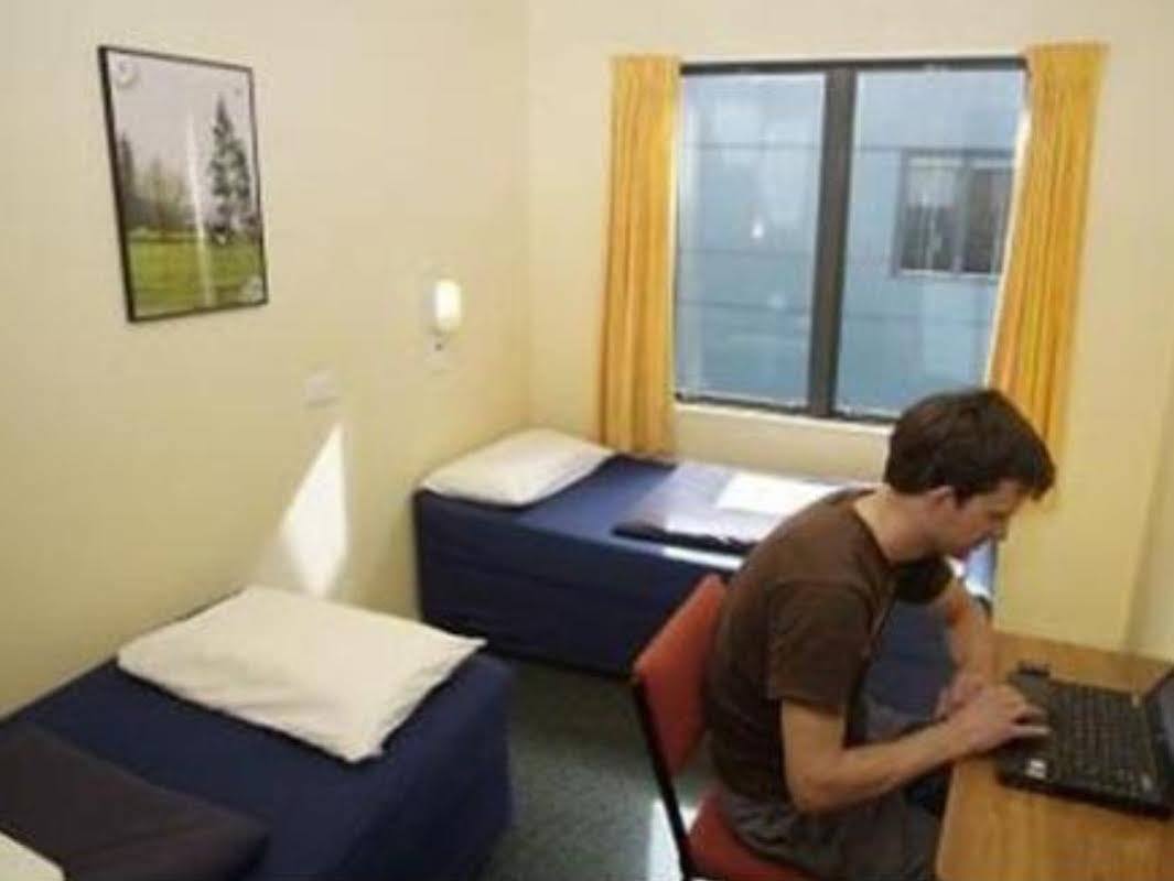 Haka House Wellington Hostel Exterior photo A student working in his room at the International House
